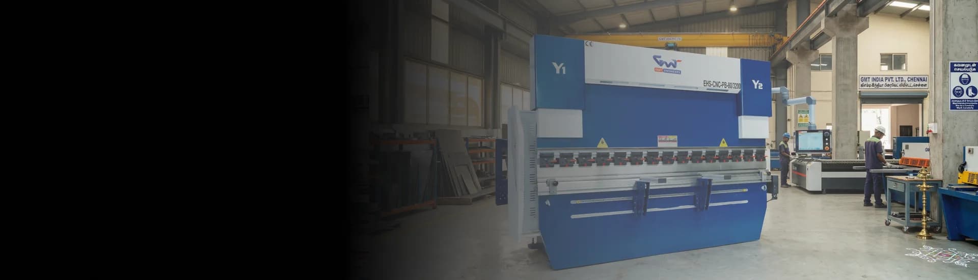 GMT Press Brake machine performing precision metal bending on a factory floor.